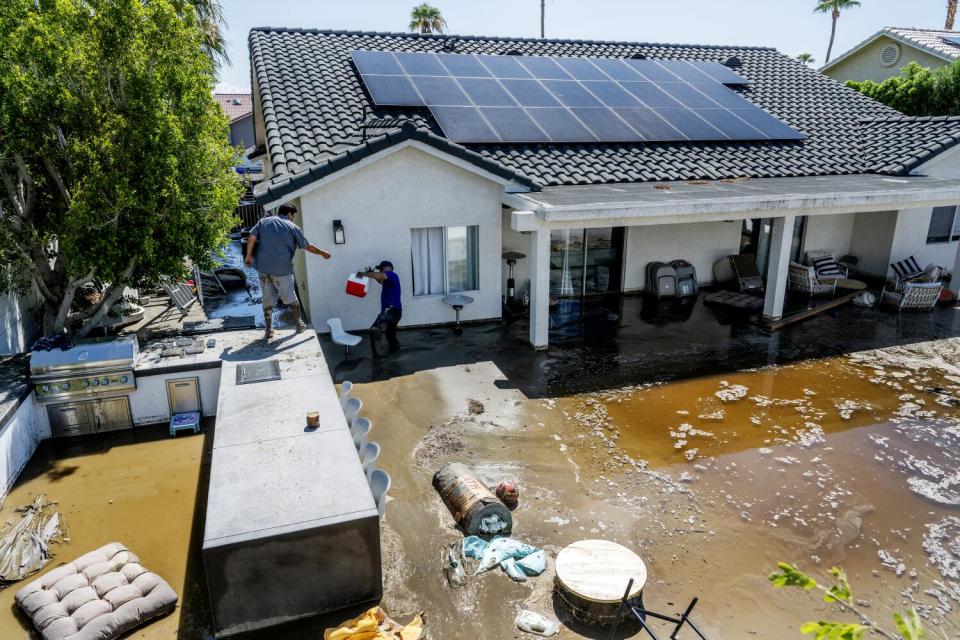 Mud fills a yard.