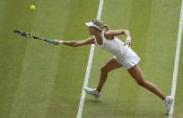 Eugenie Bouchard of Canada hits a return during her women's singles final tennis match against Petra Kvitova of the Czech Republic at the Wimbledon Tennis Championships, in London July 5, 2014. REUTERS/Gareth Fuller/Pool