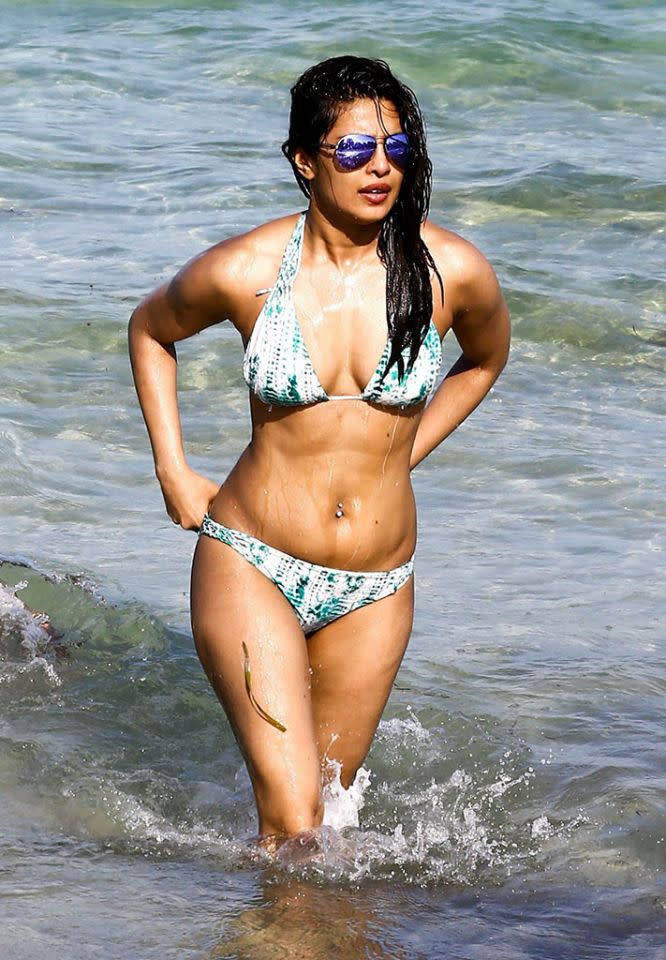 Priyanka Chopra wades in the water looking fit and fab. (Photo: Backgrid)