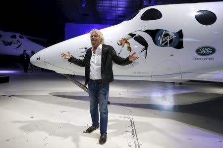 Richard Branson poses after unveiling the new SpaceShipTwo, a six-passenger two-pilot vehicle meant to ferry people into space that replaces a rocket destroyed during a test flight in October 2014, in Mojave, California, United States, February 19, 2016. REUTERS/Lucy Nicholson