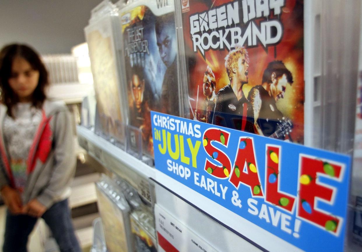 Videogames are among items promoted during a "Christmas in July Sale" at a Toys "R" Us store.
