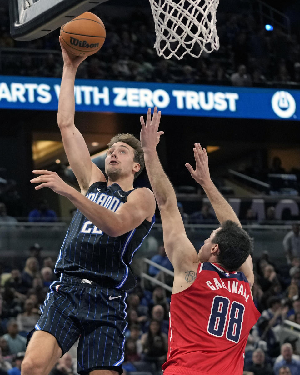 Orlando Magic forward Franz Wagner shoots against Washington Wizards forward Danilo Gallinari (88) during the first half of an NBA basketball game Friday, Dec. 1, 2023, in Orlando, Fla. (AP Photo/John Raoux)