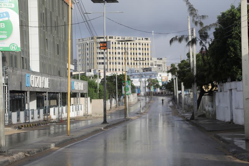 A man is seen on an empty street after the announcement of curfew on the day of the Somali presidential elections, in Mogadishu