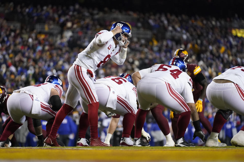 New York Giants quarterback Daniel Jones (8) gets the offense set during the first half of an NFL football game against the Washington Commanders, Sunday, Dec. 18, 2022, in Landover, Md. (AP Photo/Patrick Semansky)