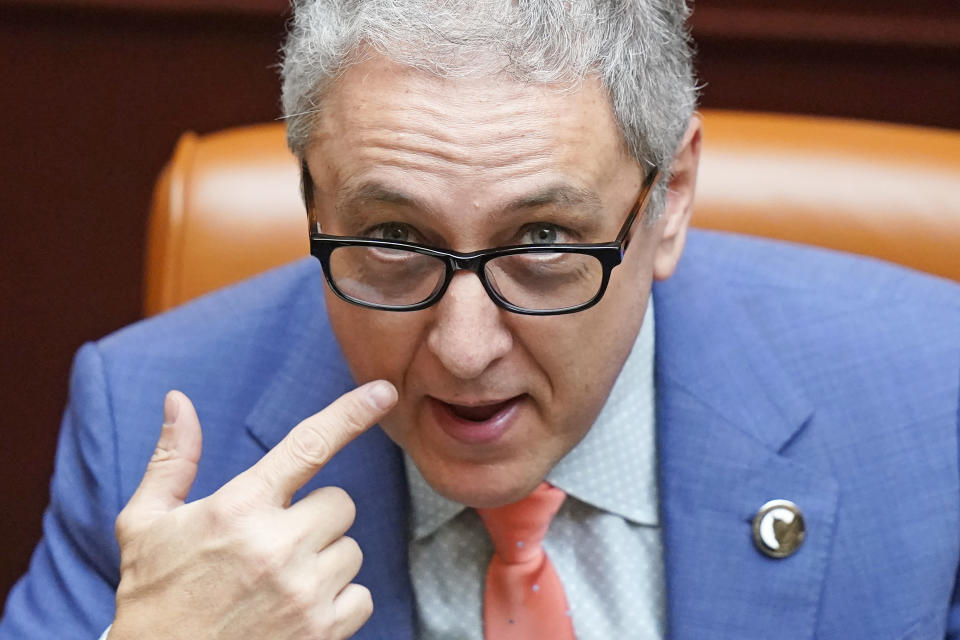 Republican Rep. Cory Maloy looks on as he sits on the floor of the Utah House of Representatives Friday, Feb. 26, 2021, in Salt Lake City. Maloy has sponsored a bill barring Utah authorities from enforcing any new federal firearm laws not also adopted by the state. (AP Photo/Rick Bowmer)