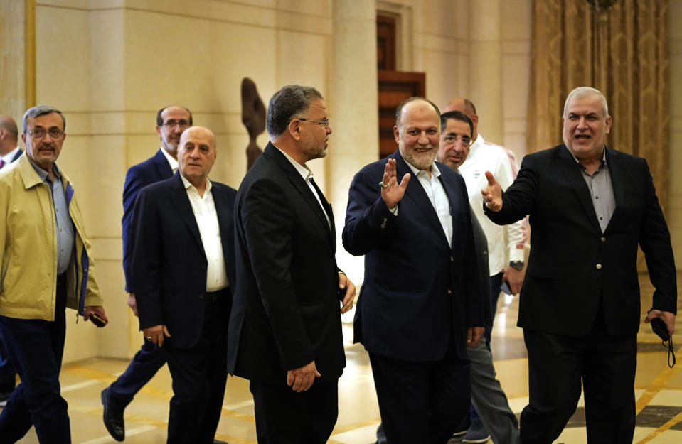 Lawmakers from the Hezbollah parliamentary block headed by Mohammed Raad, right, arrive to attend the election of the house speaker, at the parliament building, in Beirut, Lebanon, Tuesday, May 31, 2022. Lebanon's longtime parliament speaker, Nabih Berri, who has held the post for 30 years, was re-elected for a seventh four-year term Tuesday with the minimum number of required votes, a reflection of a shift in public opinion in the crumbling nation on the verge of bankruptcy. (AP Photo/Hussein Malla)