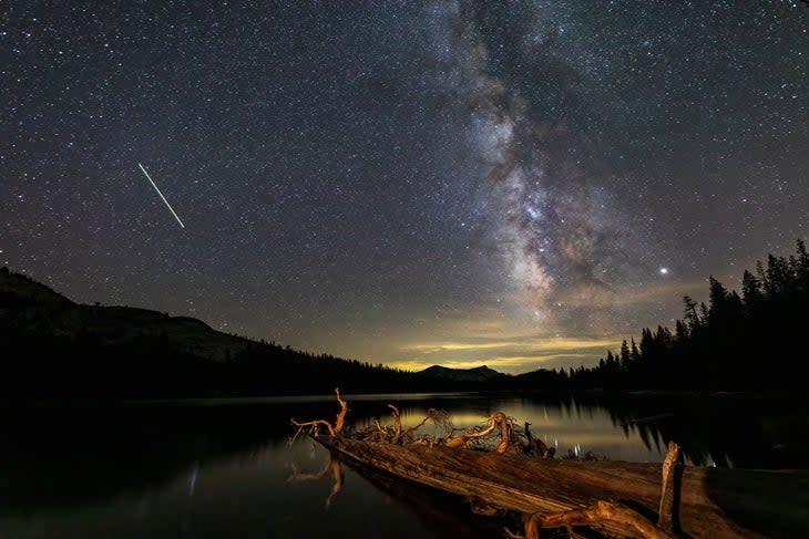 Milky Way, meteor and Jupiter reflected on the Tenaya Lake, Tuolumne Meadows, Yosemite National Park