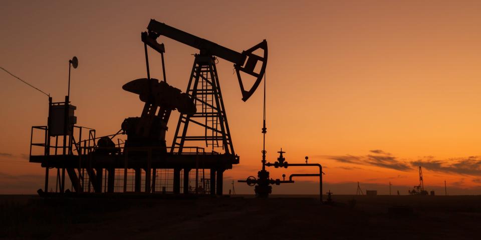 Oil pumps at sunset, industrial oil pumps equipment.