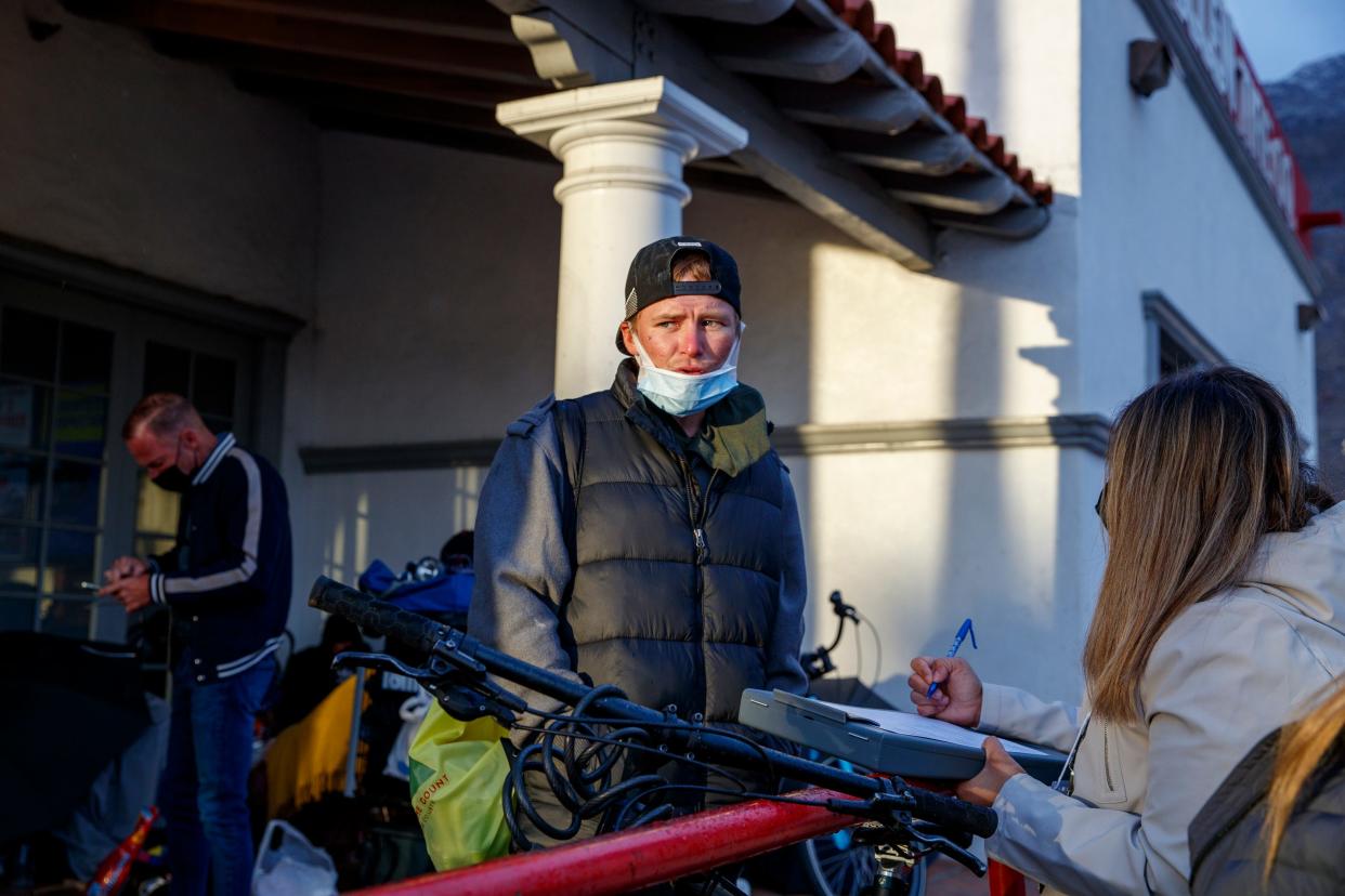 Ryan Jones, 31, answers questions during the annual Riverside County point-in-time homeless count in Palm Springs, Calif., on Wednesday, Feb. 23, 2022. 