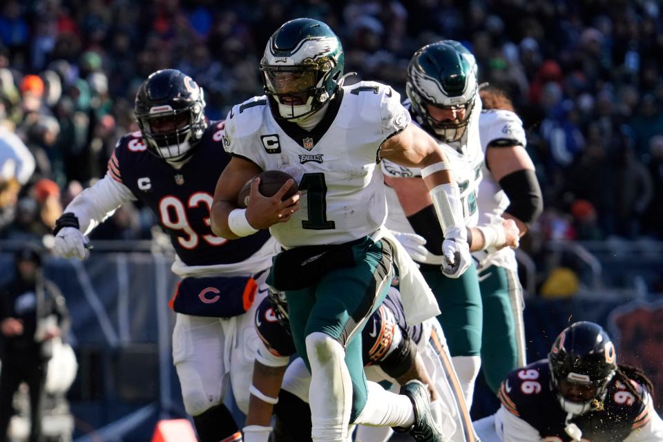 Philadelphia Eagles' Jalen Hurts runs for a touchdown during the first half against the Chicago Bears, Sunday, Dec. 18, 2022, in Chicago.