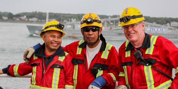 From left to right: marine workers Maynardo Maramot, Agustin Oriel and Robert MacNaull on the Oakglen.