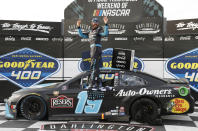 Martin Truex Jr. celebrates in Victory Lane after winning the NASCAR Cup Series auto race at Darlington Raceway, Sunday, May 9, 2021, in Darlington, S.C. (AP Photo/Terry Renna)