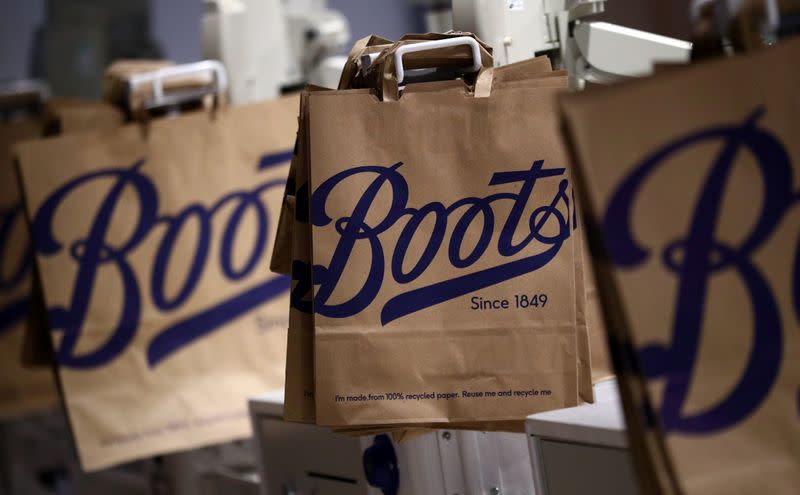 Paper carrier bags are seen in a Boots store in London