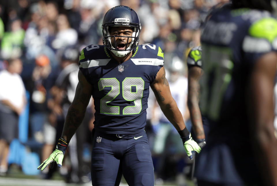 FILE - In this Sept. 23, 2018, file photo, Seattle Seahawks free safety Earl Thomas celebrates a play against the Dallas Cowboys during the first half of an NFL football game in Seattle. The Baltimore Ravens finally made their move during the NFL’s free agent frenzy, securing running back Mark Ingram and safety Earl Thomas on Wednesday, March 13, 2019. (AP Photo/Elaine Thompson, File)