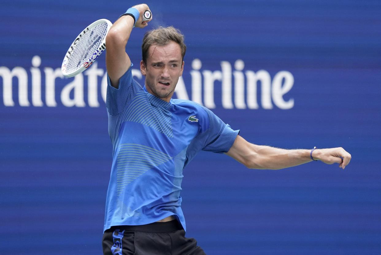 Daniil Medvedev, of Russia, returns a shot to Stefan Kozlov, of the United States, during the first round of the U.S. Open tennis championships, Monday, Aug. 29, 2022, in New York.