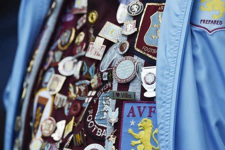 Britain Football Soccer - Watford v Aston Villa - Barclays Premier League - Vicarage Road - 30/4/16 General view of Aston Villa fan with badges Reuters / Toby Melville/ Livepic/ Files