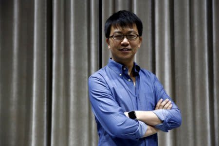 FILE PHOTO: Singulato Motors co-founder and CEO Shen Haiyin poses for pictures in Beijing, China, November 7, 2016. REUTERS/Thomas Peter/File Photo