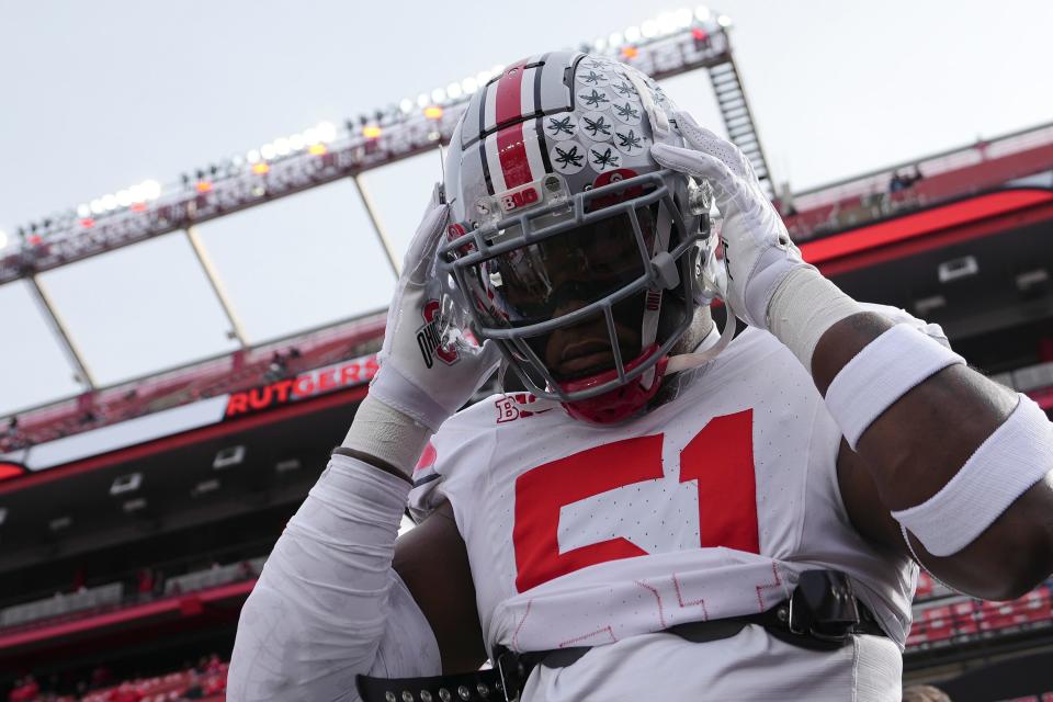 Ohio State defensive tackle Michael Hall Jr.  takes the field to warm up at Rutgers, Nov. 4, 2023.