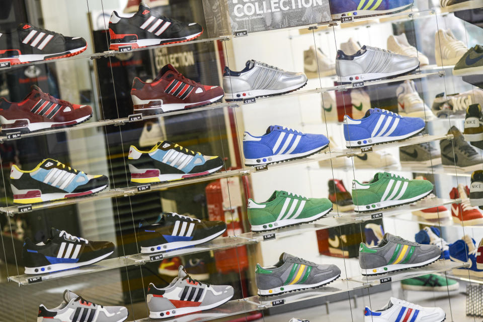 Several Adidas shoes in Foot Locker store window in Milan city centre."