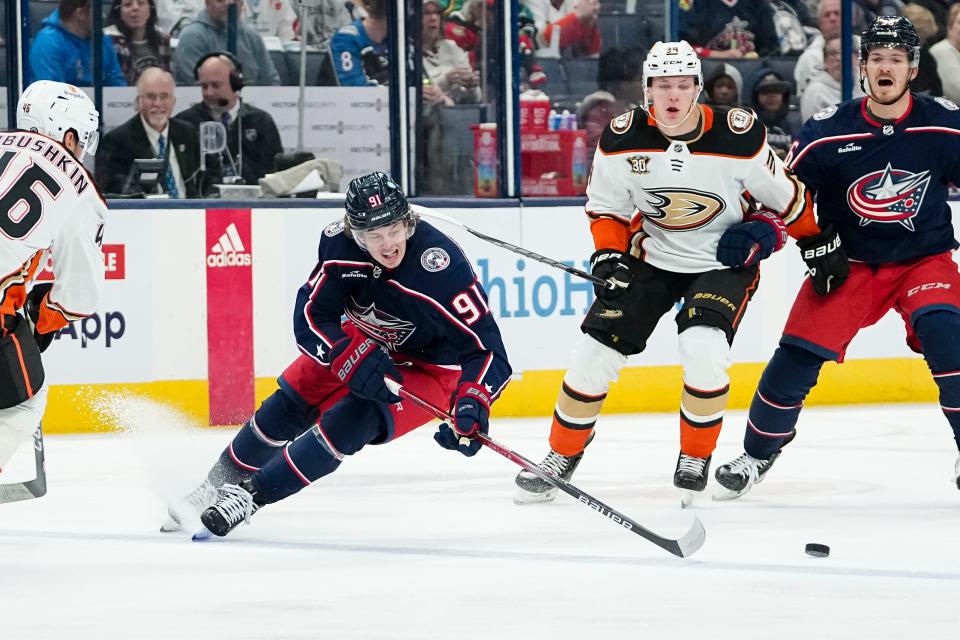 Oct 24, 2023; Columbus, Ohio, USA; Columbus Blue Jackets center Kent Johnson (91) skates around Anaheim Ducks defenseman Ilya Lyubushkin (46) during the first period of the NHL game at Nationwide Arena.