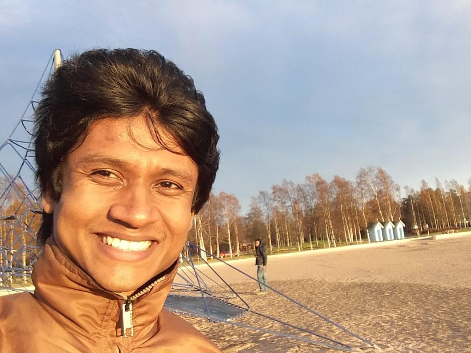 Mahmudul Islam posing for a selfie in a park in finland