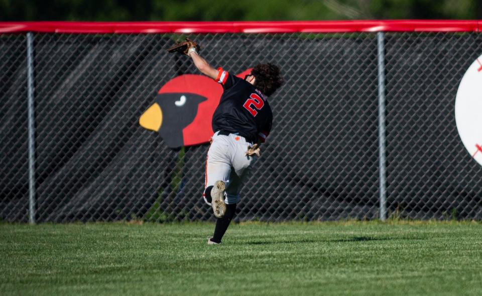 Byron sophomore right fielder Kye Aken robs Aurora Catholic's Sam Carroll of an extra-base hit with a running, back-handed catch in the Class 2A baseball sectional semifinals Friday, May 27, 2022, at Stillman Valley High School in Stillman Valley.