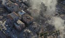 Destroyed buildings are seen from above in Antakya, southeastern Turkey, Thursday, Feb. 9, 2023. Thousands who lost their homes in a catastrophic earthquake huddled around campfires and clamored for food and water in the bitter cold, three days after the temblor and series of aftershocks hit Turkey and Syria. (AP Photo/Hussein Malla)