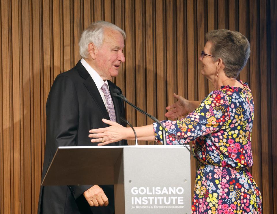 Paychex found and philanthropist Tom Golisano is greeted by Beth Paul, president of Nazareth University. Golisano donated $360 million to various organizations including several schools and colleges.