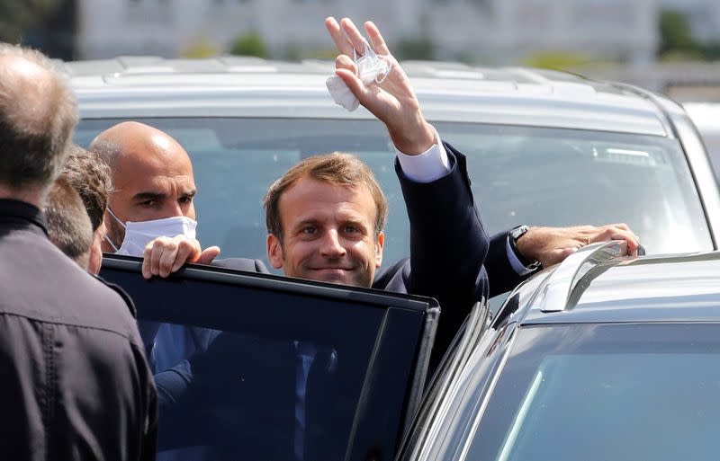 French President Emmanuel Macron enters the car as he leaves after casting his ballot during the second round of French municipal elections, in Le Touquet-Paris-Plage