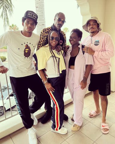 <p>Shante Broadus Instagram</p> Shante Broadus and Snoop Dogg with their three children.