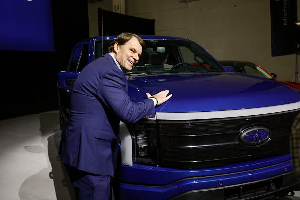 Ford CEO Jim Farley and Ford F-150 Lightning truck