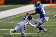 Cincinnati Bengals cornerback LeShaun Sims (38) attempts to tackle New York Giants running back Dion Lewis (33) during the first half of NFL football game, Sunday, Nov. 29, 2020, in Cincinnati. (AP Photo/Aaron Doster)