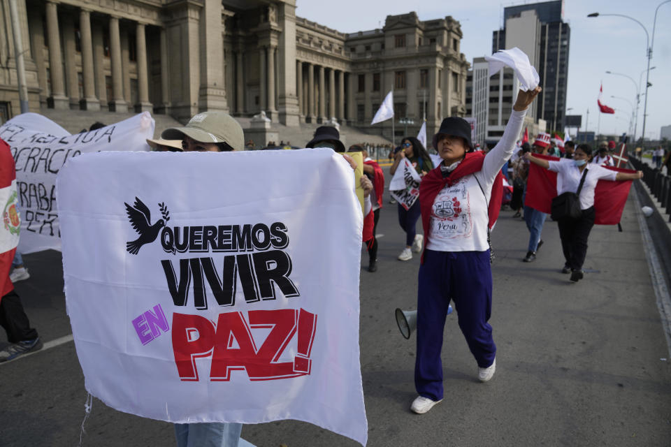 Demonstrators take part in a peace march in Lima, Peru, Saturday, Jan. 21, 2023. Unrest that has engulfed large portions of the country since former President Pedro Castillo was impeached and imprisoned after he tried to dissolve Congress on Dec 7, 2022. (AP Photo/Martin Mejia)