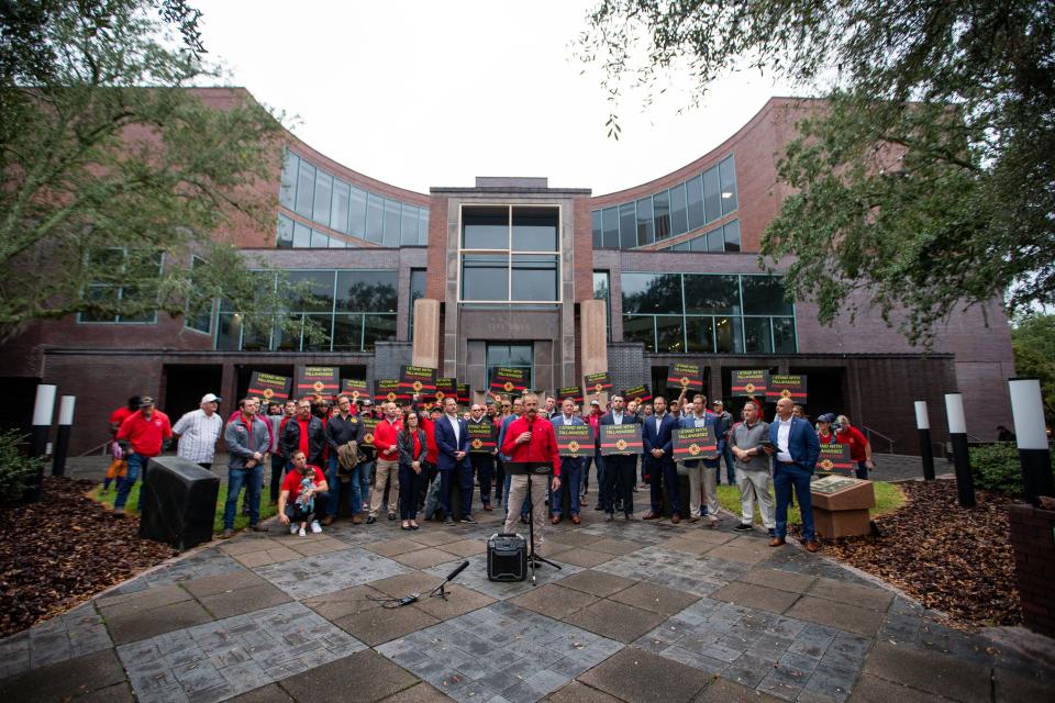 Tallahassee firefighters hold a press conference in front of City Hall demanding fair wages Wednesday, Nov. 15, 2023.