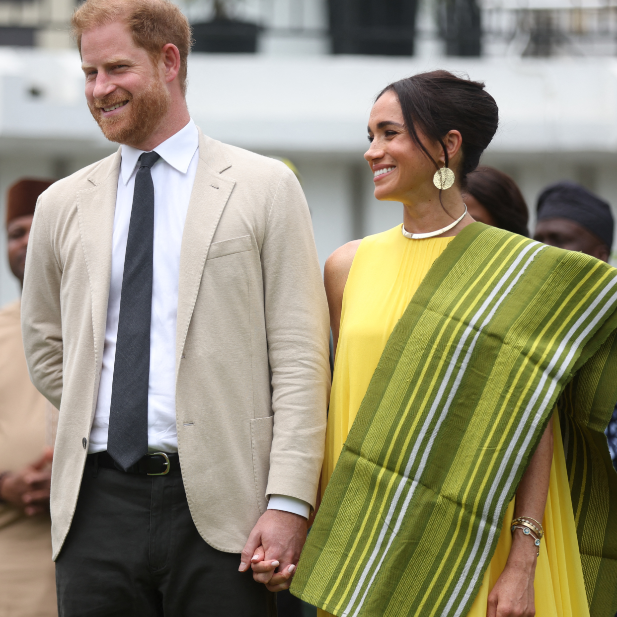  Britain's Prince Harry (2ndR), Duke of Sussex, and Britain's Meghan (R), Duchess of Sussex, react as Lagos State Governor, Babajide Sanwo-Olu (unseen), gives a speech at the State Governor House in Lagos. 