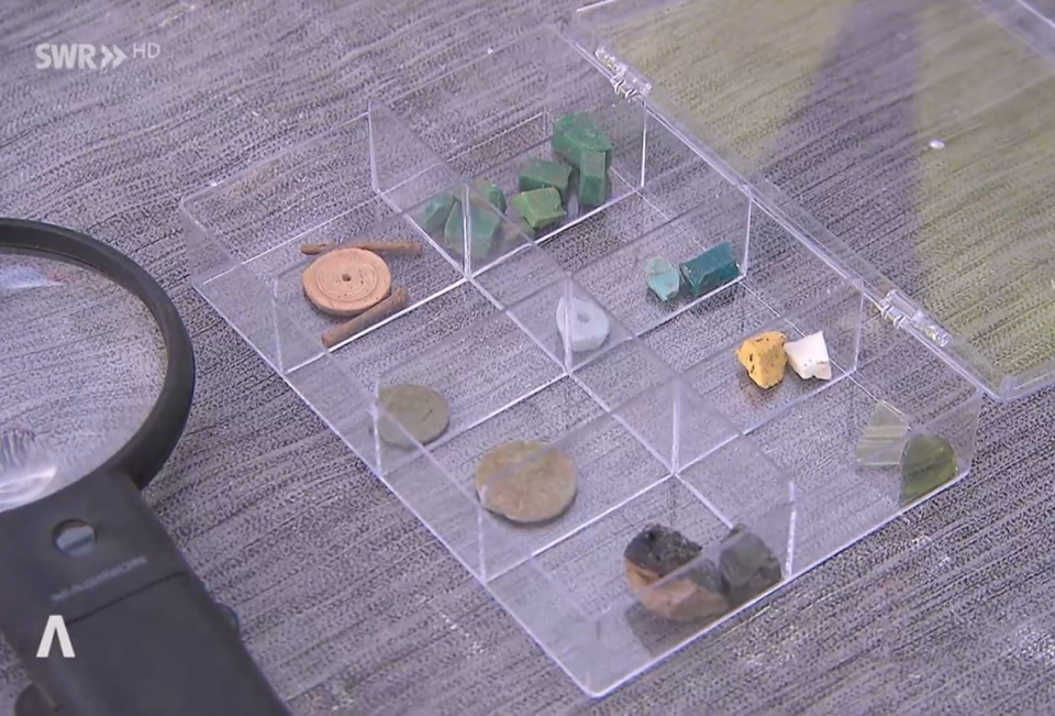 Coins and other fragmented relics unearthed at the site.