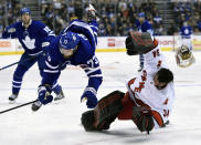 Carolina Hurricanes goaltender Petr Mrazek (34) hits the ice after Toronto Maple Leafs left wing Kyle Clifford (73) skated into him during second-period NHL hockey game action in Toronto, Saturday, Feb. 22, 2020. (Frank Gunn/The Canadian Press via AP)