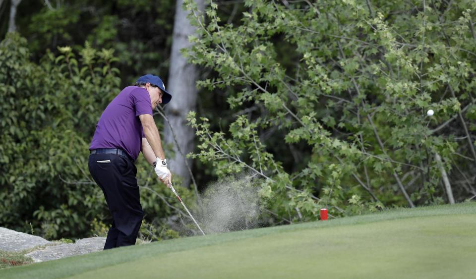 Phil Mickelson hits to the green on the second hole during round-robin play against Si Woo Kim, of South Korea, at the Dell Technologies Match Play golf tournament at Austin County Club, Wednesday, March 22, 2017, in Austin, Texas. (AP Photo/Eric Gay)