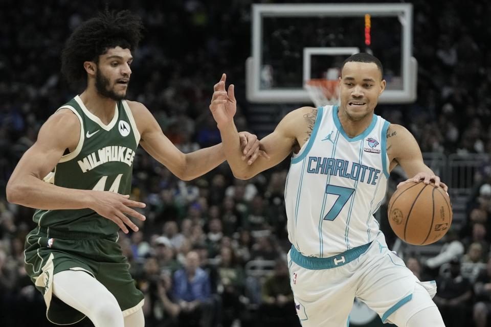 Charlotte Hornets' Bryce McGowens tries to get past Milwaukee Bucks' Andre Jackson Jr. during the second half of an NBA basketball game Friday, Feb. 9, 2024, in Milwaukee. (AP Photo/Morry Gash)