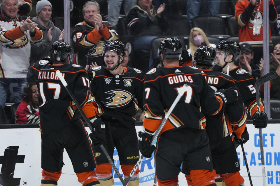 Anaheim Ducks center Mason McTavish, second from left, celebrates with teammates after scoring against the Winnipeg Jets during the first period of an NHL hockey game Friday, Jan. 5, 2024, in Anaheim, Calif. (AP Photo/Ryan Sun)