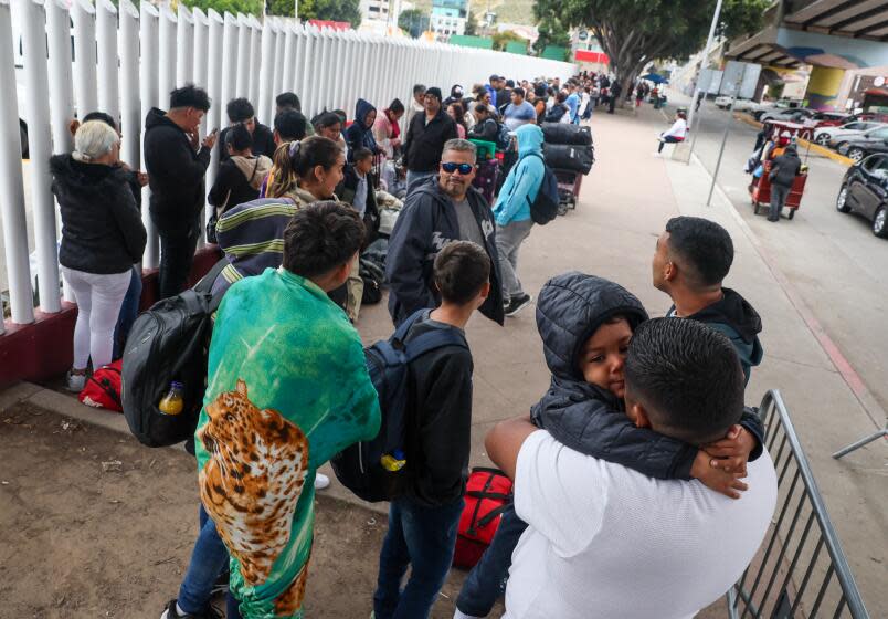 Tijuana, Mexico, Thursday, April 25, 2024 - Hundreds of asylum seekers who used a CBP phone app to make an appointment, wait to for a scheduled interview with U.S. border agents at the San Ysidro Border Crossing. (Robert Gauthier/Los Angeles Times)