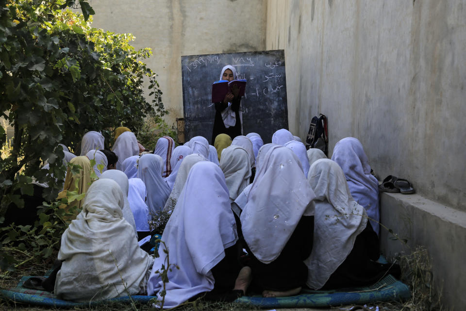 Afghan students attend an open air class at a primary school in Kabul, Afghanistan, Wednesday, Oct. 7, 2020. The World Bank said this week that nearly half of Afghanistan’s 18,000 schools lack proper buildings and an estimated 3.7 million children are still out of school — despite massive investment in the country’s education sector. (AP Photo/Mariam Zuhaib)