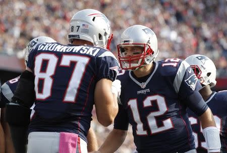 Oct 16, 2016; Foxborough, MA, USA; New England Patriots quarterback Tom Brady (12) congratulates tight end Rob Gronkowski (87) on a touchdown during the third quarter against the Cincinnati Bengals at Gillette Stadium. Mandatory Credit: Stew Milne-USA TODAY Sports