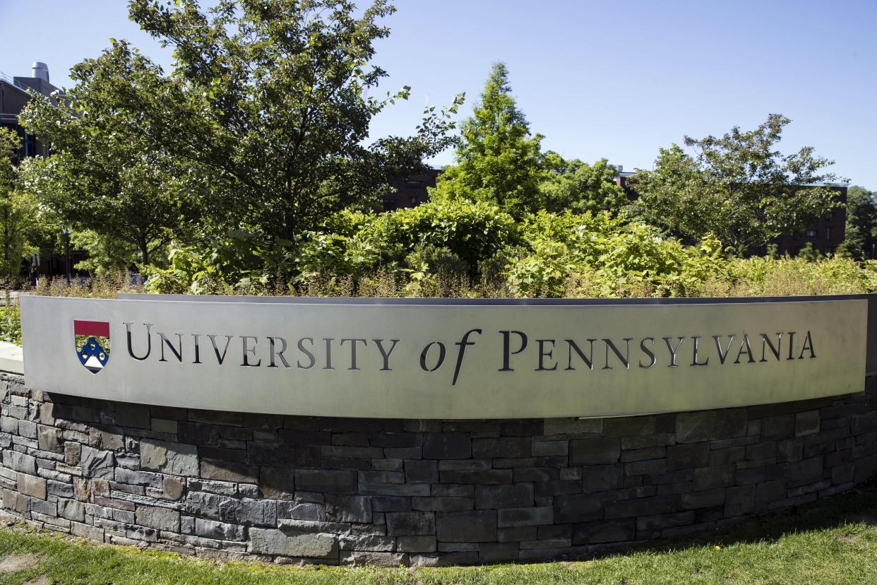 FILE — The University of Pennsylvania sign is shown in Philadelphia, May 15, 2019. At Cornell and the University of Pennsylvania, officials have banned indoor social events as COVID infections spread. (AP Photo/Matt Rourke, File)