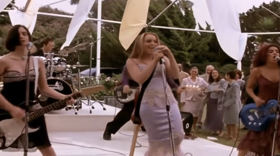 a group of women singing and playing instruments