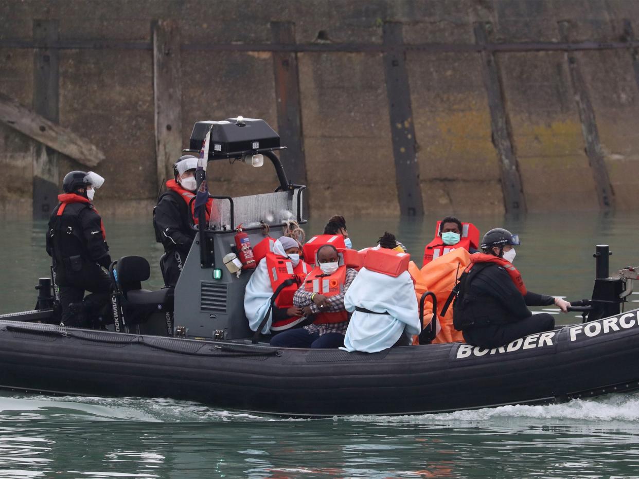 A group of people thought to be migrants are brought into Dover, Kent, by Border Force following a small boat incident in the Channel (PA )