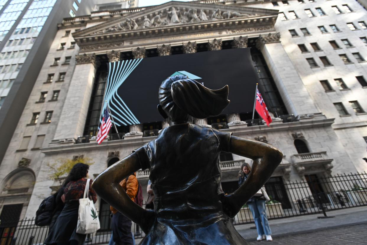 FTSE The Fearless Gir statue stands in front of the New York Stock Exchange (NYSE) on November 16, 2023 in New York City.