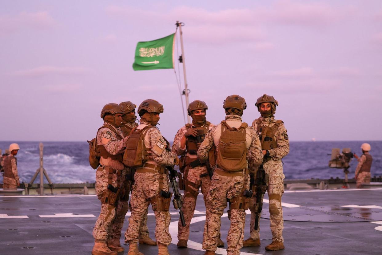 Saudi security officers stand guard off the seaport of Port Sudan in April 2023. Fayez Nureldine/AFP via Getty Images