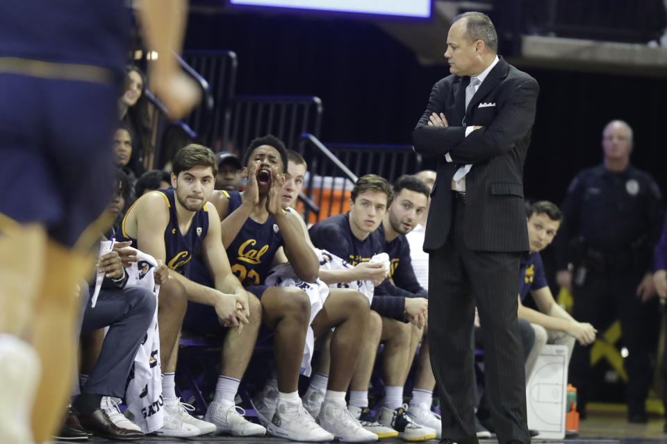 California coach Mark Fox, right, looks toward the bench during the first half of the team's NCAA college basketball game against Washington, Saturday, Feb. 22, 2020, in Seattle. (AP Photo/Ted S. Warren)