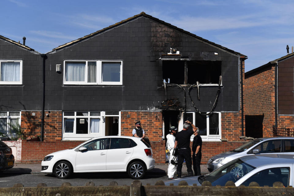 Police and forensics officers at the scene of a house fire on Adolphus Street, Deptford, south-east London, in which a seven-year-old boy died (Picture: PA)